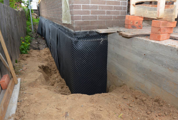 SJ Waterproofing Pros technician performing targeted Interior Drainage System assessment in Waldorf, MD